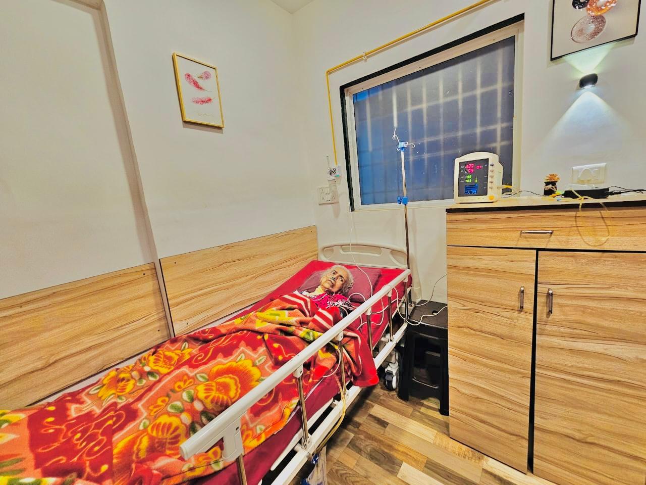A patient recovering under monitoring in a private room